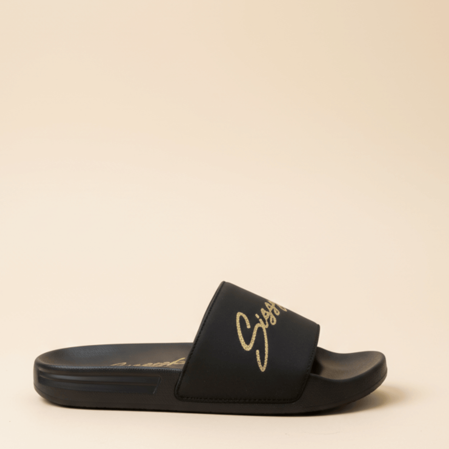 Black women’s slides with gold Sissy Boy logo on the straps,