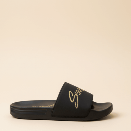 Black women’s slides with gold Sissy Boy logo on the straps,