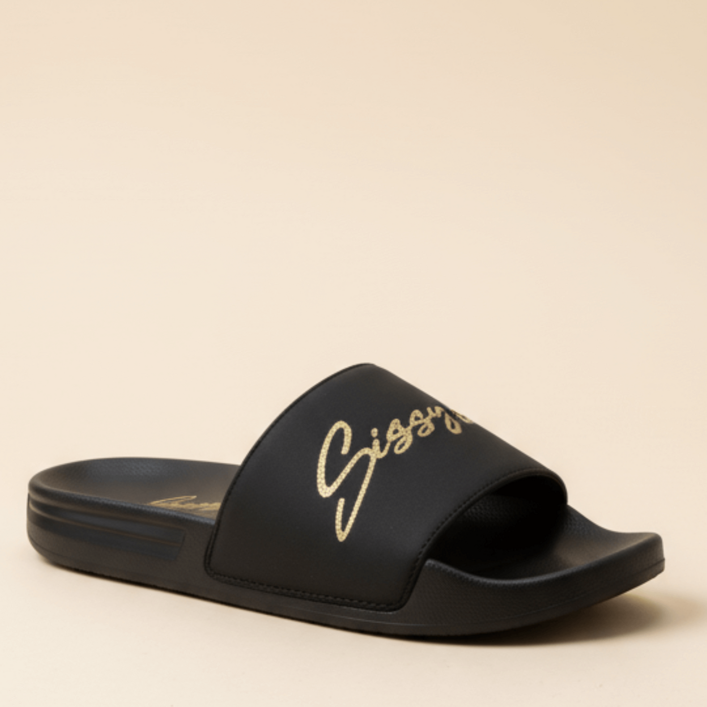 Comfortable black open-toe slides with gold Sissy Boy logo in elegant script across the strap