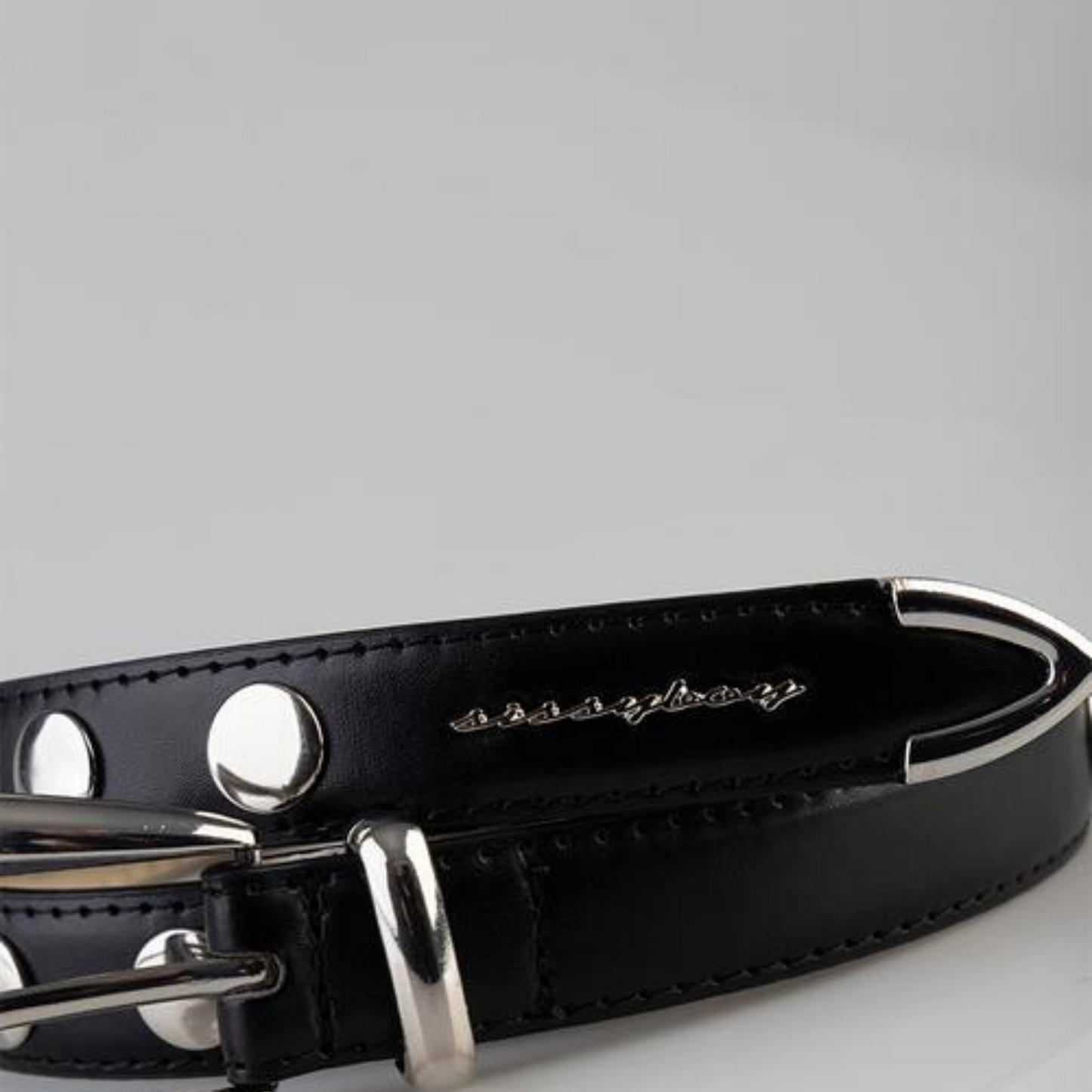 Stylish black women's belt with silver studs and buckle