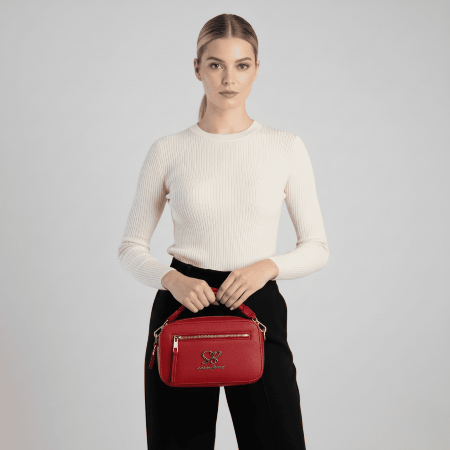 Sissy Boy red camera bag with front pocket and gold branding