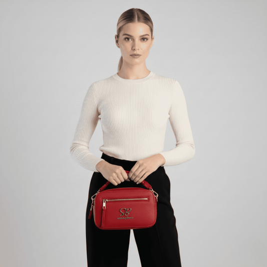 Red Sissy Boy crossbody bag featuring adjustable strap and zip closure