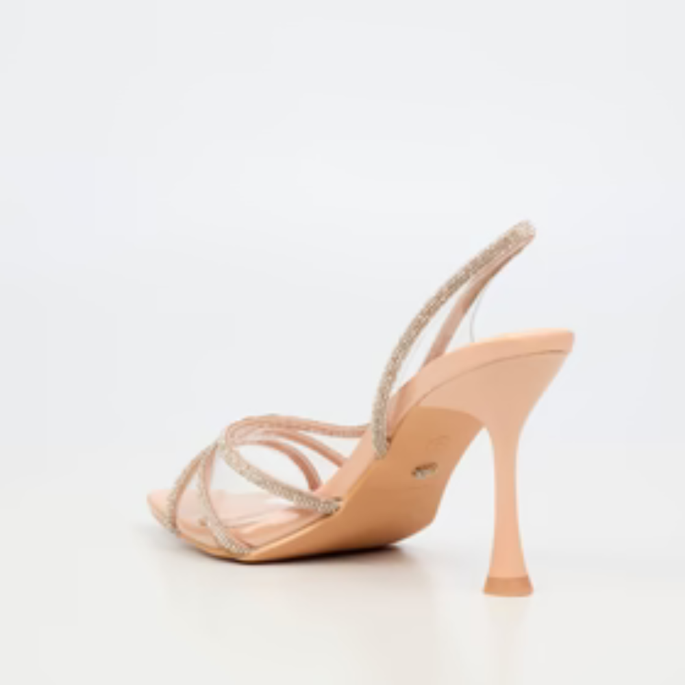 evening heel in nude with transparent straps and pointed toe.