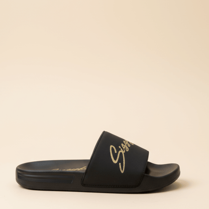 Black women’s slides with gold Sissy Boy logo on the straps,