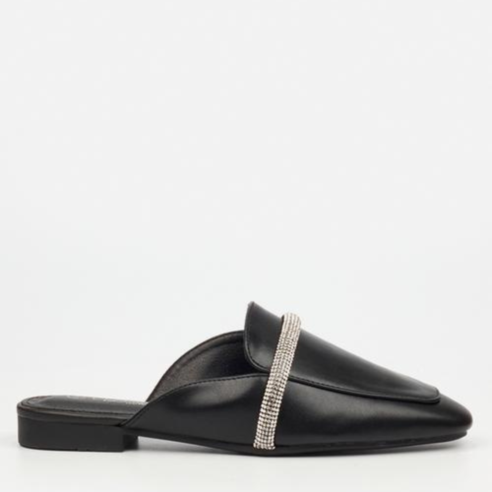 A black leather mule with a rhinestone-encrusted strap across the vamp.