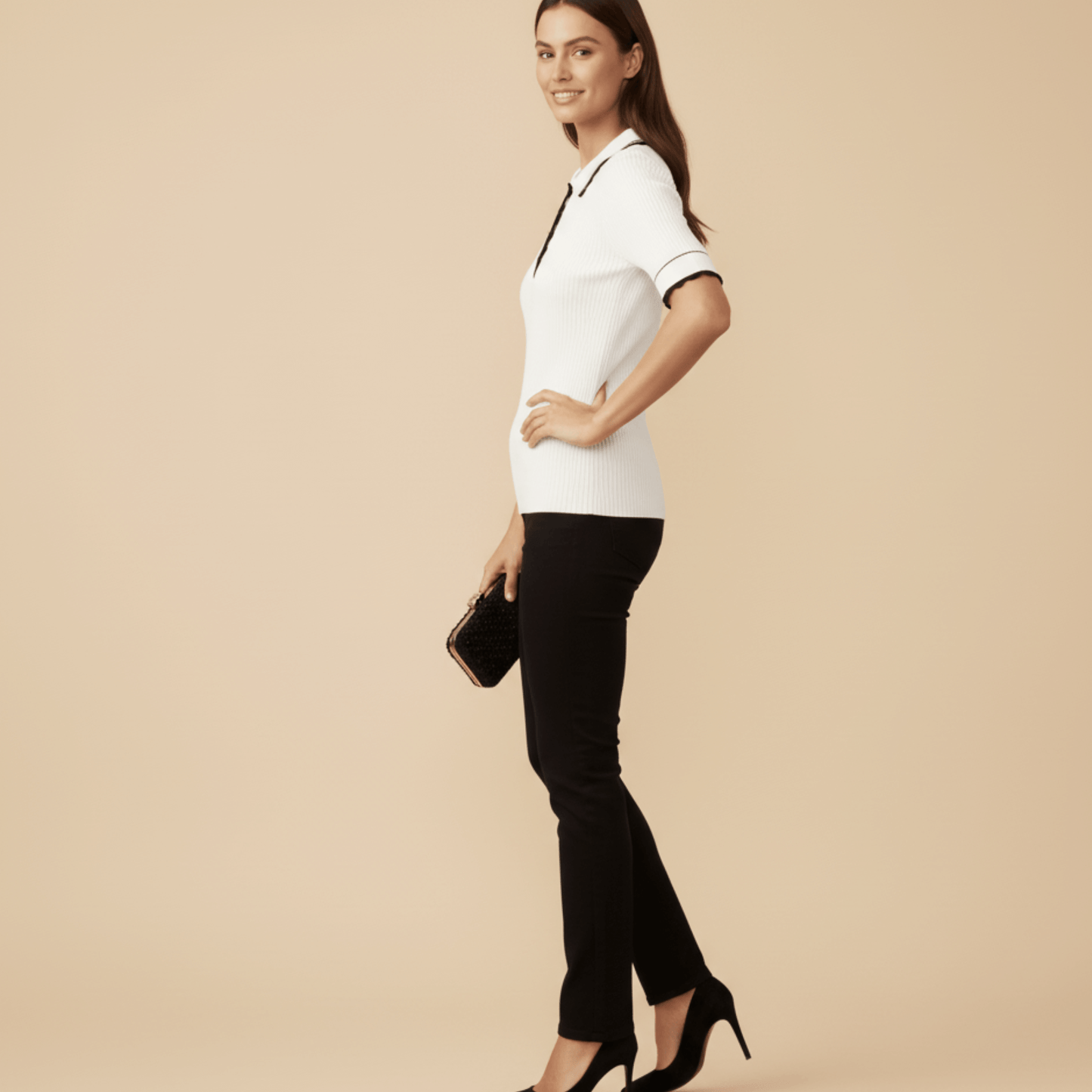 Women’s white ribbed knit golf shirt with gold button detail