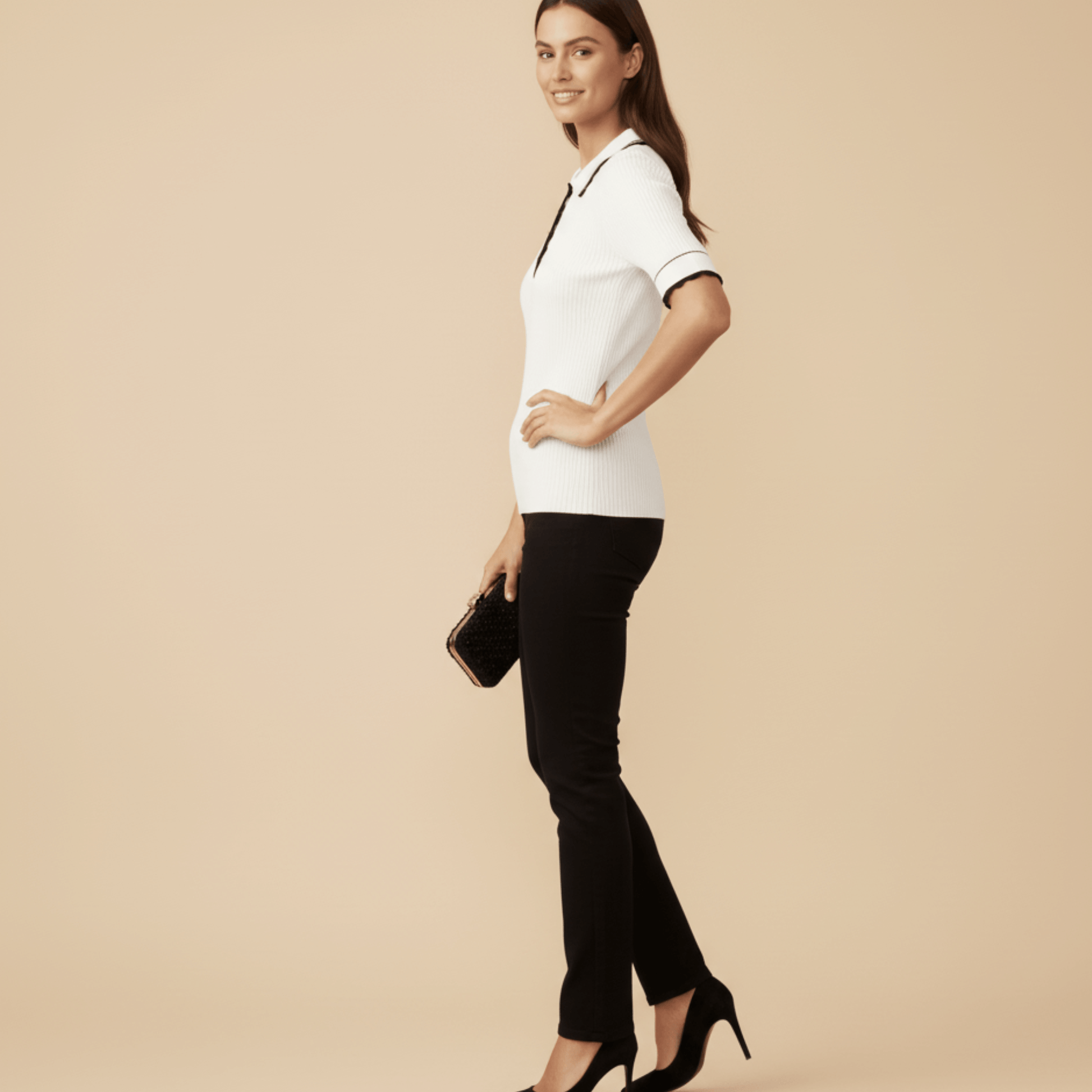 Women’s white ribbed knit golf shirt with gold button detail
