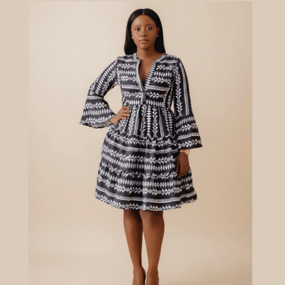 Black boho print dress with bell sleeves and tiered skirt,