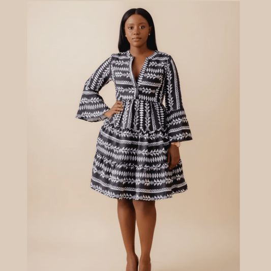 Black boho print dress with bell sleeves and tiered skirt,