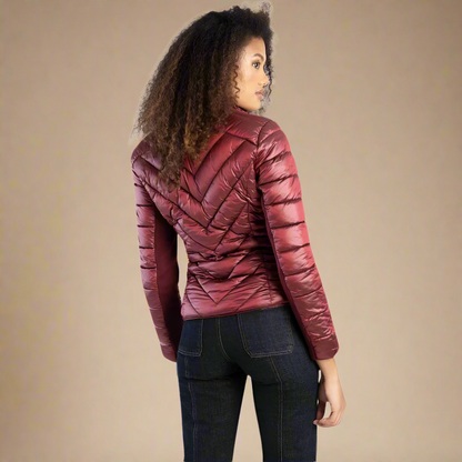 Stylish and warm Ravila burgundy puffer jacket for women, ideal for layering in colder months.