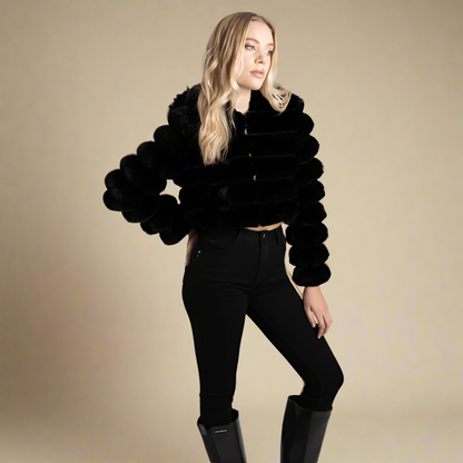 Luxurious black faux fur cropped jacket by Sissy Boy, styled with skinny jeans for a chic winter look.