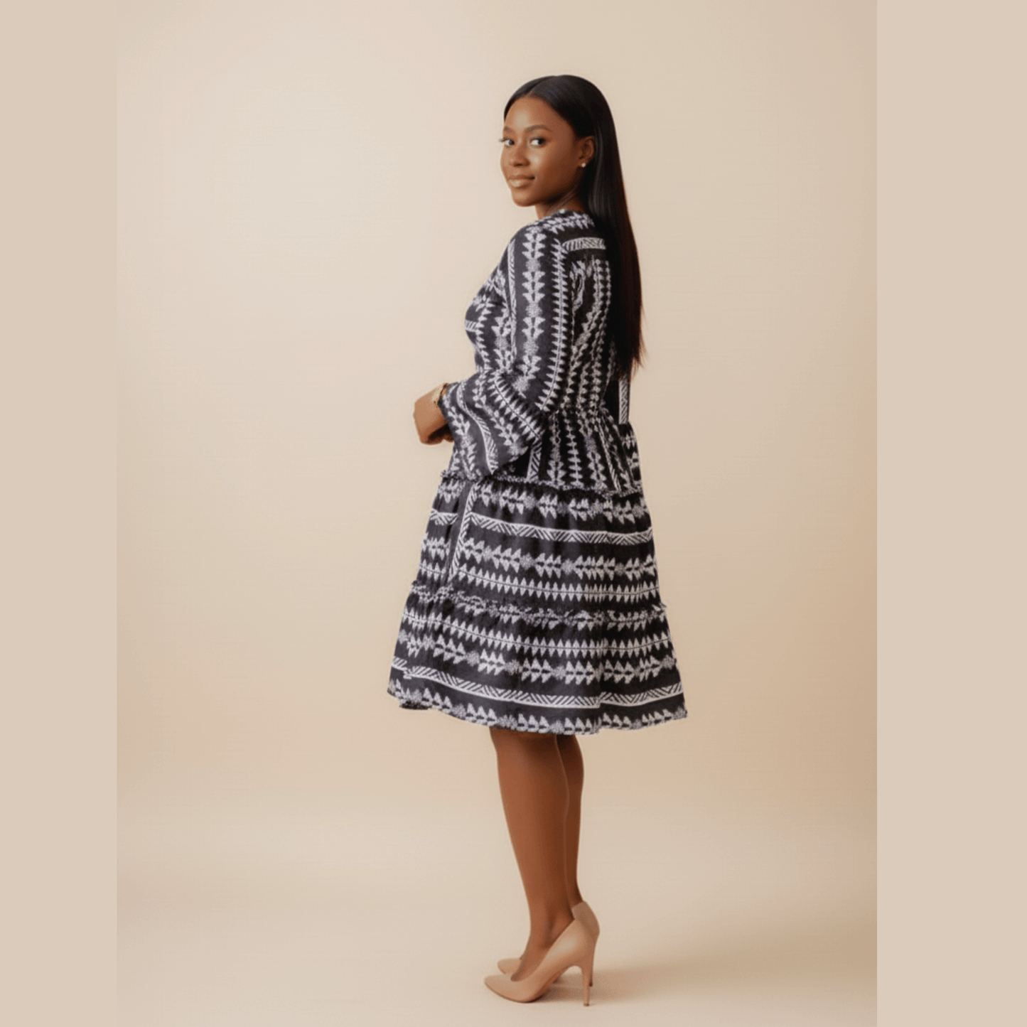 Elegant black ethnic patterned dress for women, featuring flared sleeves and fitted waist