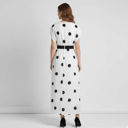  Classic long polka dot dress with wide cap sleeves and black high heels.