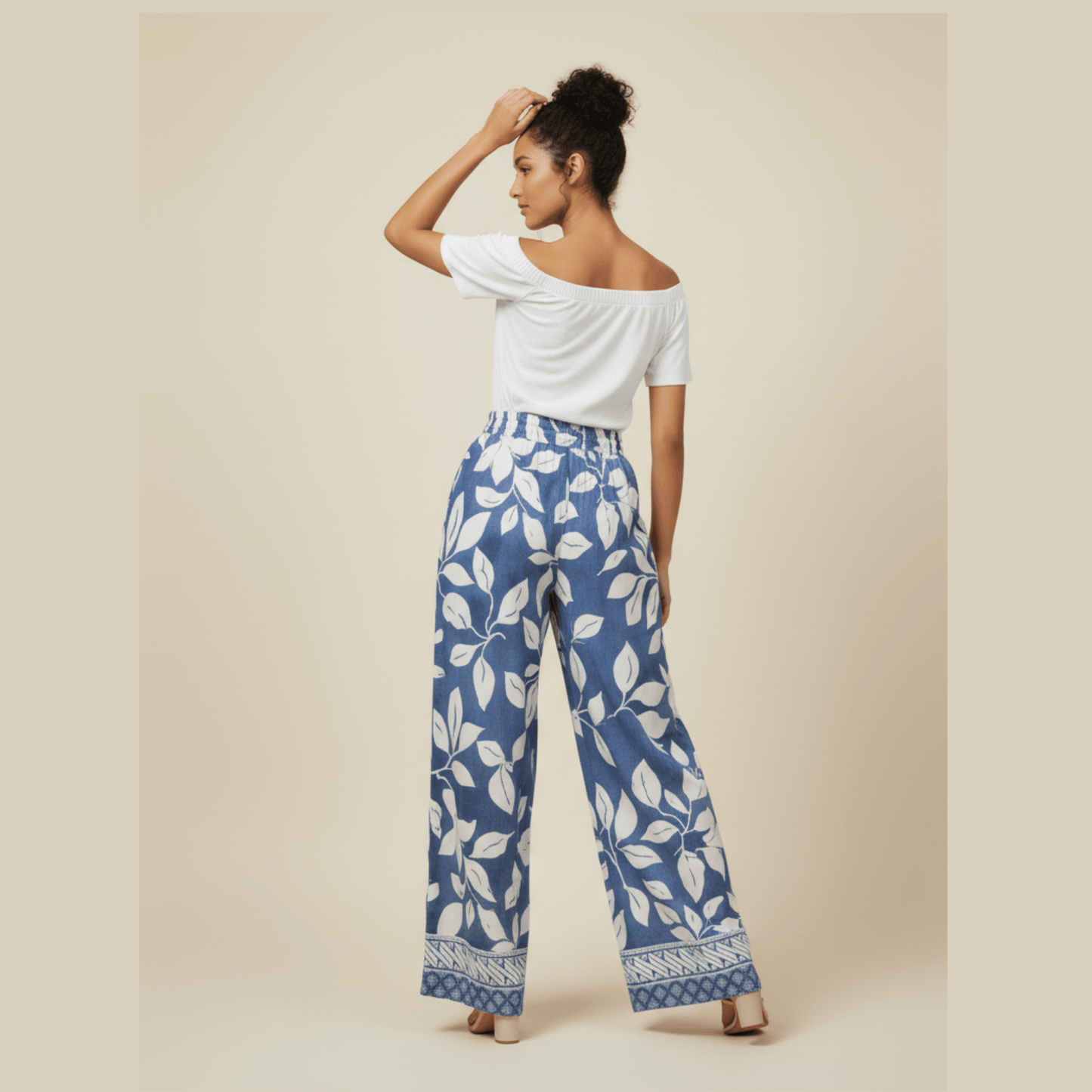 Chic blue and white printed trousers with elastic waistband and tie-front belt by Modern Dynasty