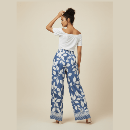 Chic blue and white printed trousers with elastic waistband and tie-front belt by Modern Dynasty