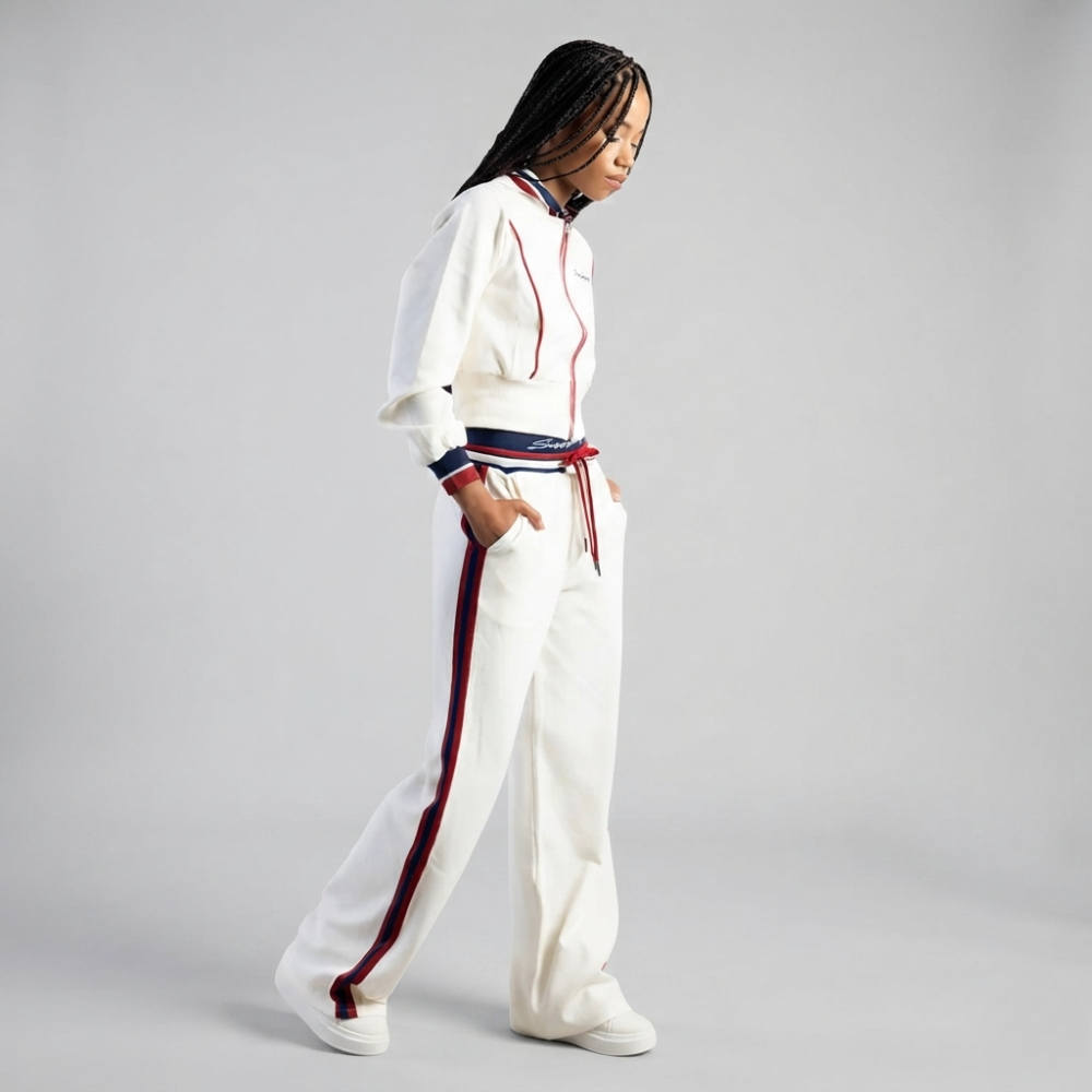 Fashion model wearing Sissy Boy Off Your Game cream hoodie and matching track pants women's casual outfit