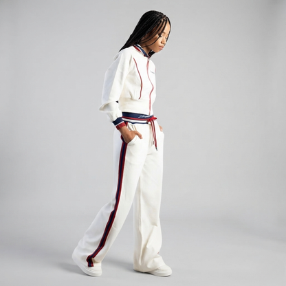 Fashion model wearing Sissy Boy Off Your Game cream hoodie and matching track pants women's casual outfit