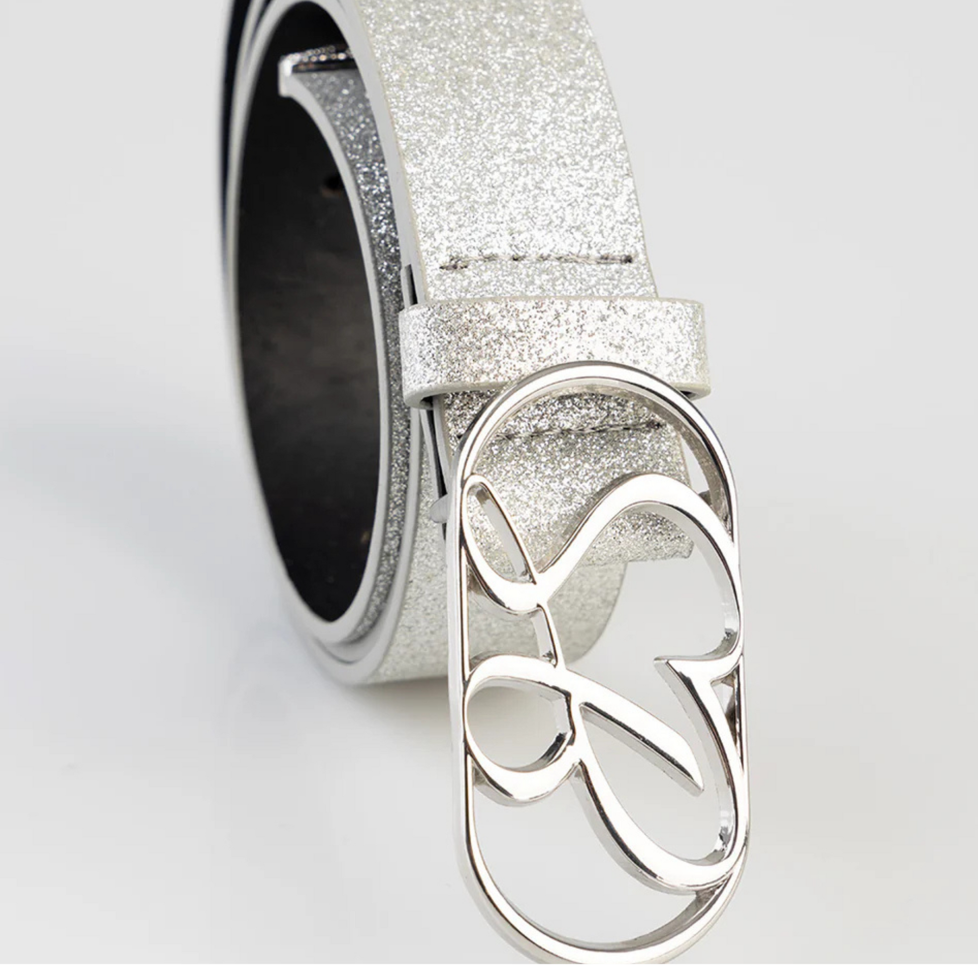 "Sissy Boy Silver Glam Belt featuring sparkly finish and adjustable loopholes