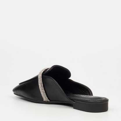 A comfortable and chic mule with a modern twist, adorned with a rhinestone detail.