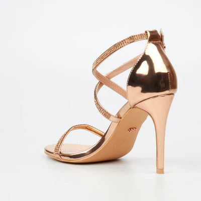Rose gold high heel sandal with diamante embellishments and elegant criss-cross strap design