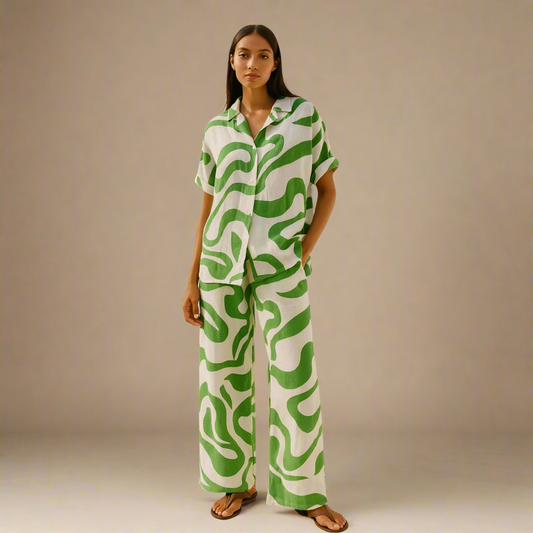  Modern Dynasty’s Moolit Majesty co-ord set in white and green, featuring a loose-fit short-sleeve button-up shirt and matching wide-leg trousers 