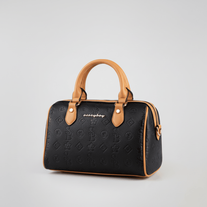 Black and tan Sissy Boy bowler bag with elegant contrast piping and signature branding