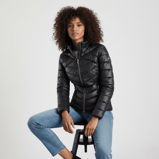 Women’s black puffer jacket with fitted silhouette and zip pockets by Sissy Boy