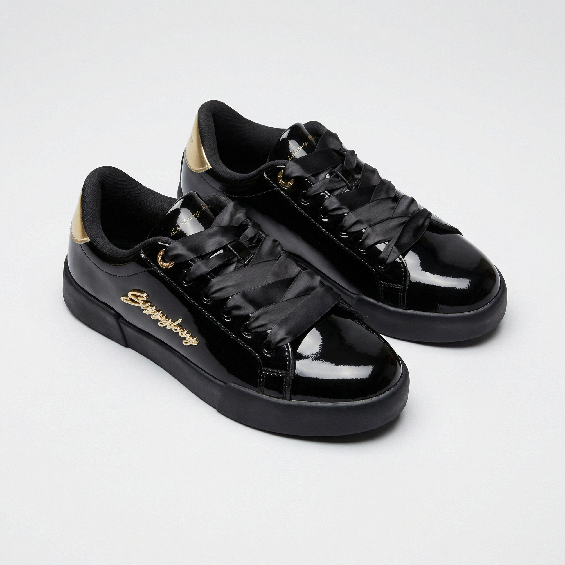 Women’s black patent Sissy Boy sneakers